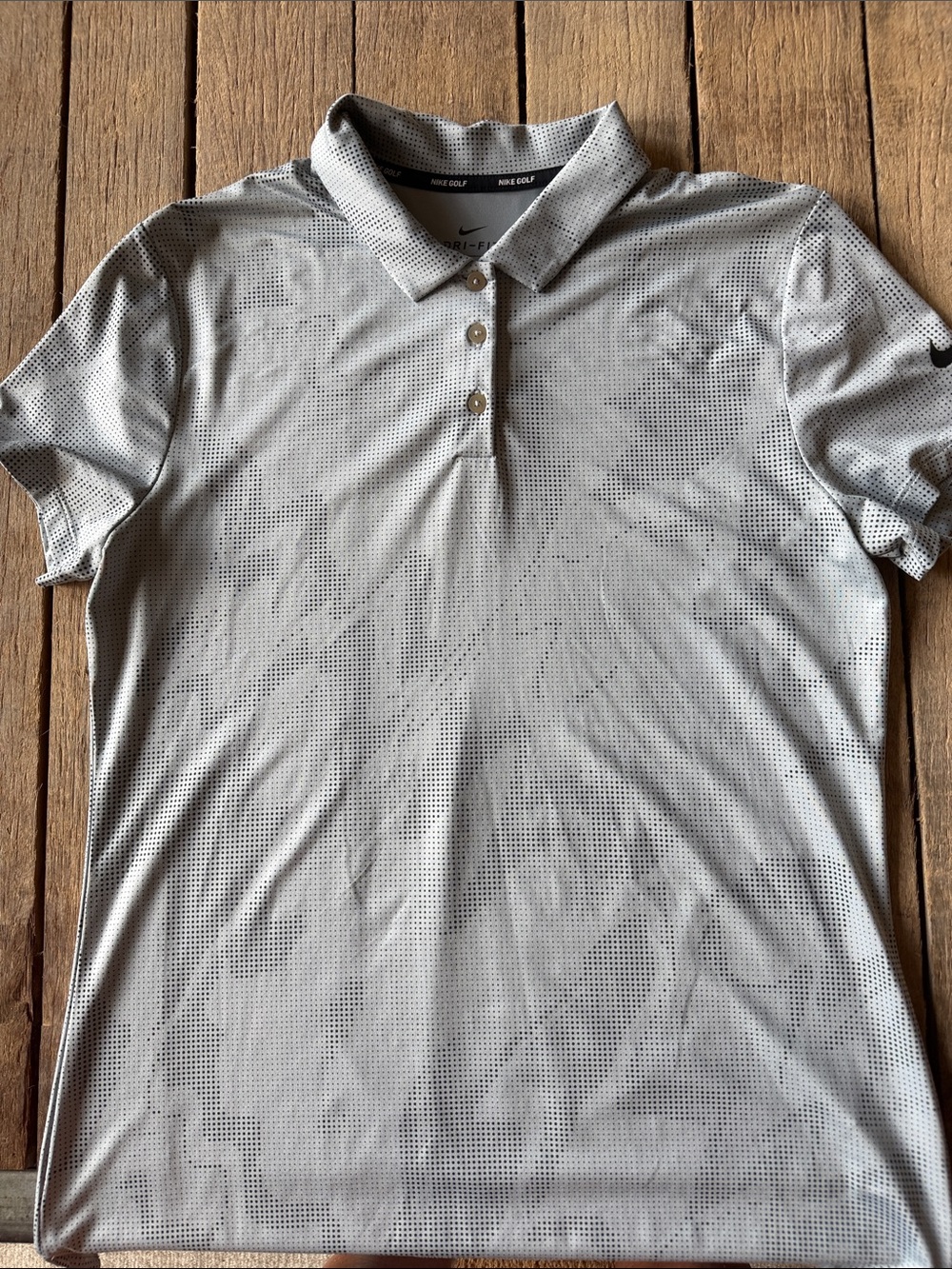 Woman’s medium Nike Drifit golf shirt